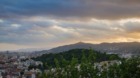 Blue yellow clouds on hills near Barcelona, summer Spainの写真素材