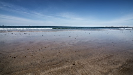 Endless sand shore of Atlantic ocean at low-tide in Saint-Malo, Franceの写真素材