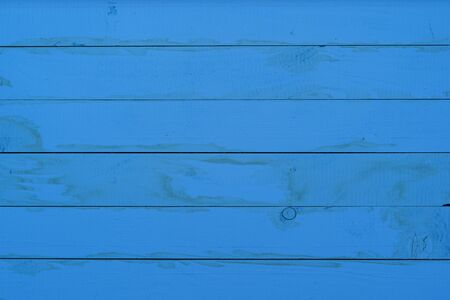 Vintage blue wood background texture with knots and patternの写真素材