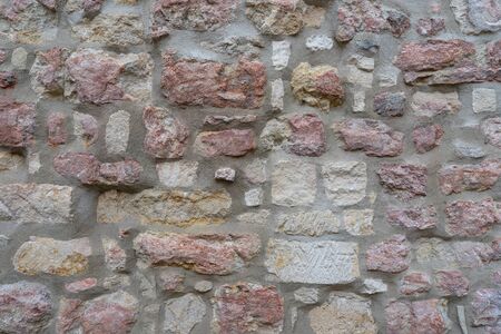 Old brick wall with cracks and scratches. Horizontal wide brickwall backgroundの写真素材