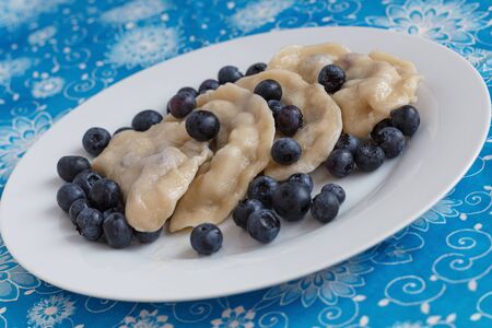 Russian dumplings vareniki filled with fresh blueberriesの写真素材