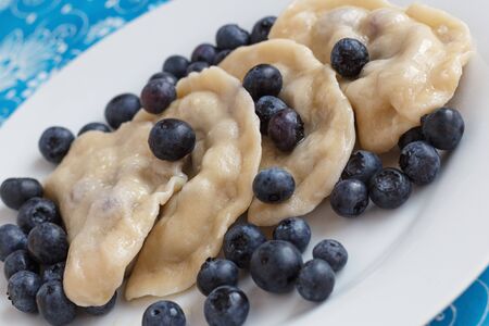 Russian dumplings vareniki filled with fresh blueberriesの写真素材