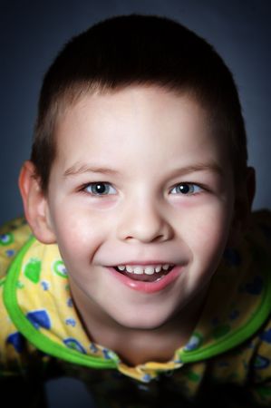 Cheerful and happy boy gives a smile to all の写真素材