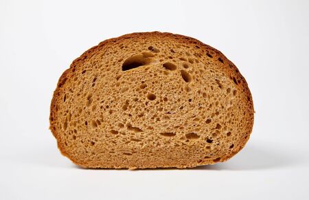 Slice of brown bread, isolated on white