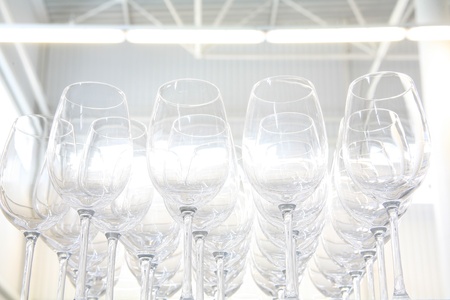 Rows and rows of shiny glass goblets, creating an interesting background.の写真素材