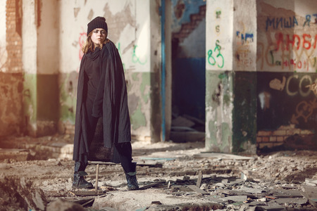 In an old abandoned house beautiful gothic girl