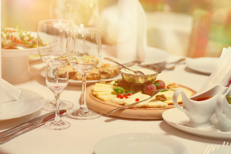 Tables set and salad served for a wedding reception.の写真素材