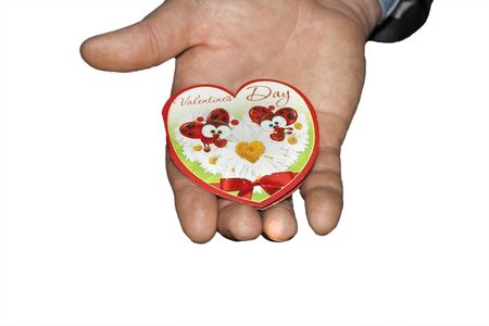 Hand man in a suit holding a heart postcard. Valentine's Dayの写真素材