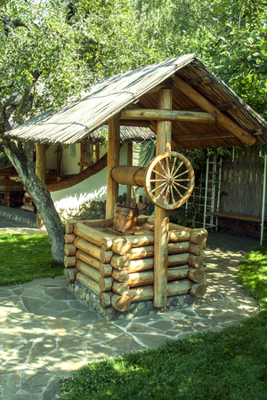 ancient wooden well. summer sunny dayの写真素材