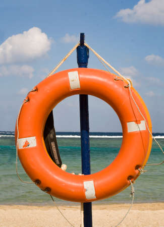 Lifebuoy hangs on the background of the sea.の写真素材