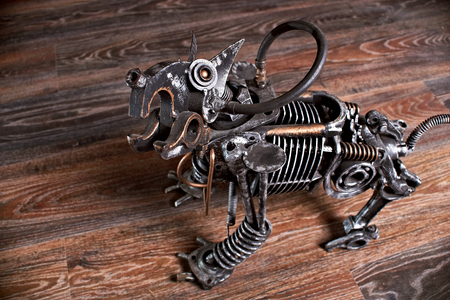 old mechanical dog robot on a brown backgroundの写真素材