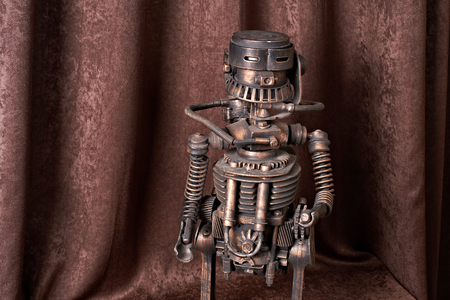 old mechanical robot on a brown backgroundの写真素材