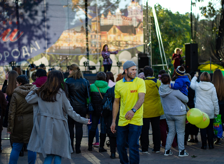 Dancing students in the crowd at the scene, which hosts the city festival and perform creative...