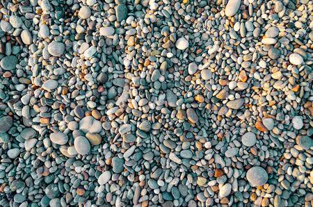 Abstract nature pebbles background. Blue small pebbles texture. Stone background. Various sea peblles beach. Turquoise colorの写真素材