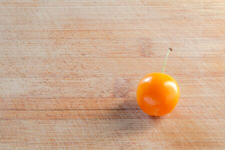 Cherry plum on a wooden surface. Wood texture. Empty space. Close-upの写真素材