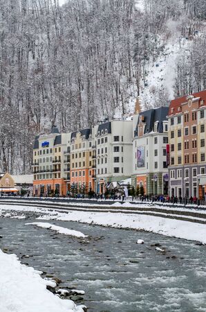 Sochi, Russia - December 29, 2018: Beautiful buildings near the winter river in a mountain alpine village. Vertical frameのeditorial素材
