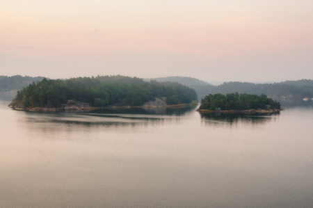 foggy island. small island. morning on the archipelagoの写真素材