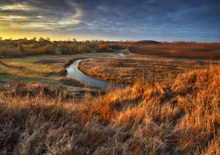 autumn nature. Landscape of sunrise over river in autumn morning. Nature of Ukraineの写真素材