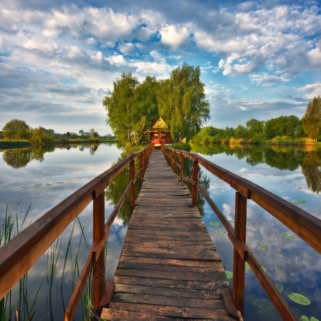 small house on the island. bridge on a picturesque lake. nature of Ukraineの写真素材