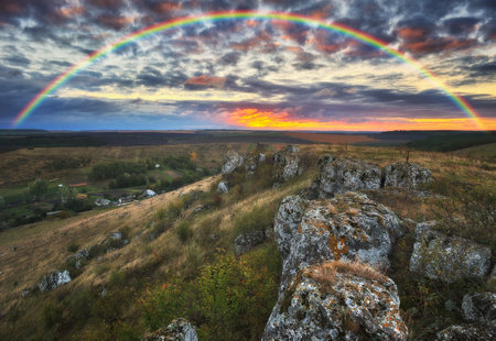 Rainbow with clouds over a rock. nature of Ukraineの写真素材
