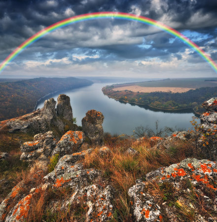 Rainbow over the river. Dramatic overcast sky. Ukraine, Europe. beauty world.の写真素材
