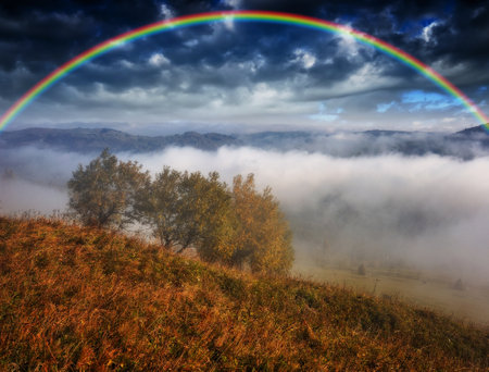 Rainbow over the Mountains. autumn morning in the Carpathians. Nature of Ukraineの写真素材