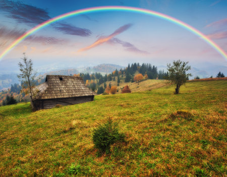 Rainbow over the Mountains. autumn morning in the Carpathians. Nature of Ukraineの写真素材
