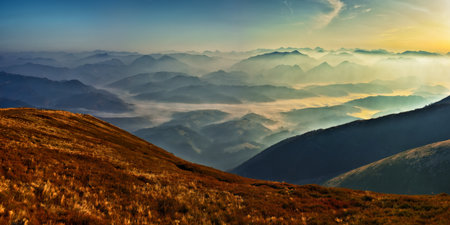 mountain silhouettes in the fog. Graphic landscape on the theme of mountainsの写真素材