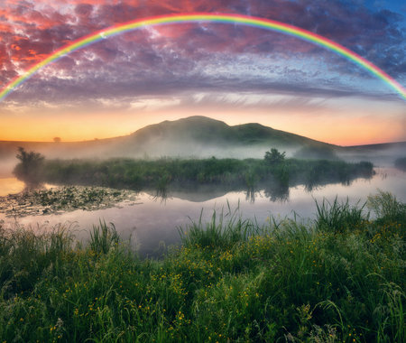 Landscape with a Rainbow on the River in Spring. colorful morning. nature of Ukraineの写真素材
