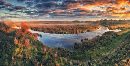 Autumn morning in the picturesque river valley. Autumn landscape with clouds. Nature of Ukraine
