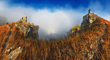 Church on the rock. Autumn landscape with fog. Nature of Ukraineの写真素材