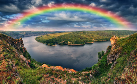 Rainbow over the river Dnister. Landscape with a rainbow in the sky. Nature of Ukraineの写真素材
