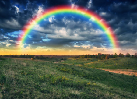 Beautiful rainbow over the field. Agricultural landscape. Nature of Ukraineの写真素材