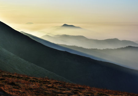 silhouettes of morning mountains. foggy morning in the Carpathians. Mountain landscapeの写真素材