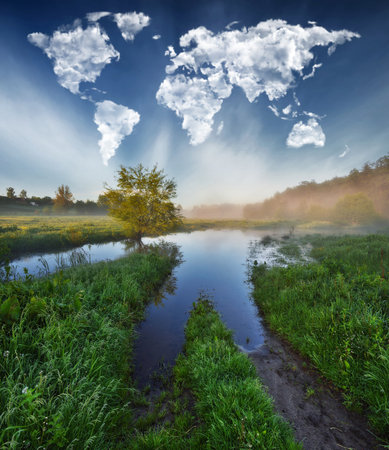 beautiful summer landscape with river and clouds in the form of heartの写真素材