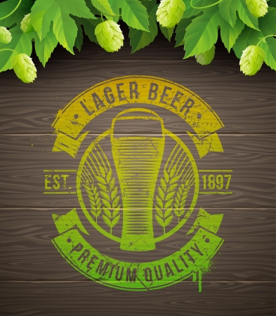 Beer emblem painted on wooden surface and ripe hops and leaves - vector illustrationのイラスト素材