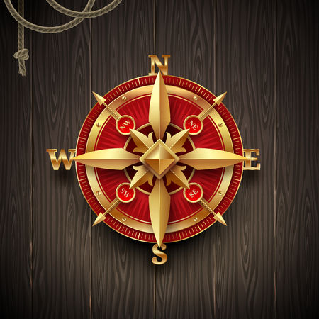 Golden ancient compass rose on a wooden plank background. Vector illustration.のイラスト素材