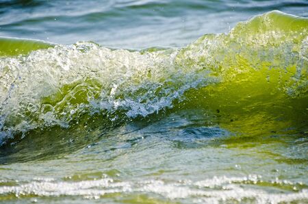 Sea water splashing waves on a beautiful nature