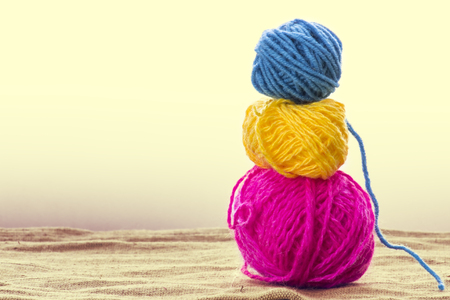 Balls of wool on background, old retro vintage styleの写真素材