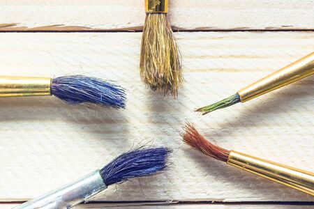 artist paint brushes on  wooden table.の写真素材