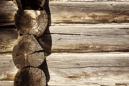 Wooden logs wall of old rural house as backgroundの写真素材