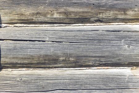 Wooden logs wall of old rural house as backgroundの写真素材