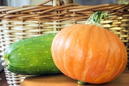 Pumpkin and squash on a background of the basketsの写真素材