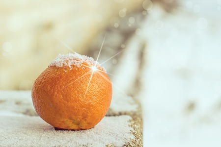 Christmas and New Year Mandarins on the snowの写真素材