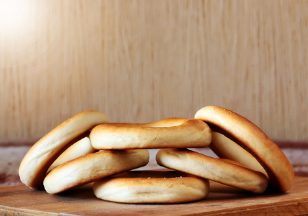 National Russian bagels on a wooden board and a plaidの写真素材