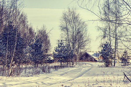 Russian village in the winter. Retro style.の写真素材
