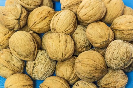 Walnuts on a blue backgroundの写真素材