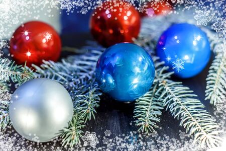 Christmas background. Spruce branch on the wooden with the light of candlesの写真素材