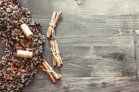 Cinnamon sticks and cork from wine on a wooden backgroundの写真素材