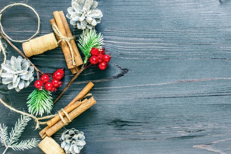Cinnamon sticks and cork from wine on a wooden backgroundの写真素材